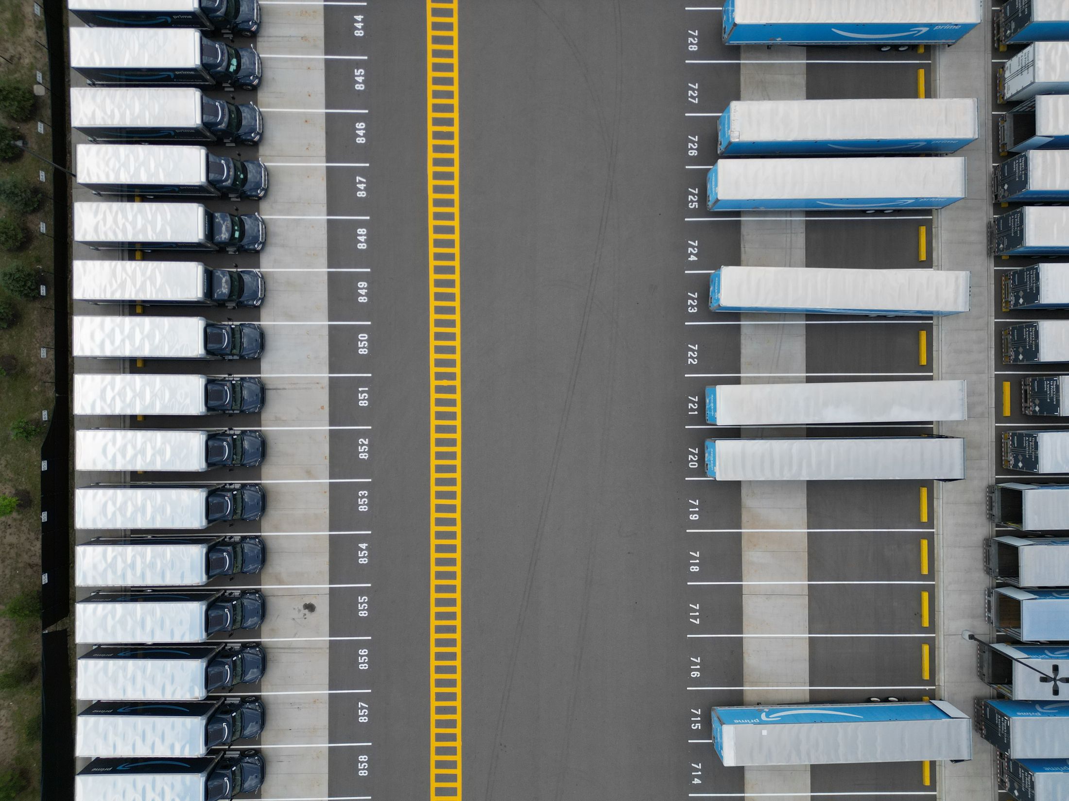 Aerial view of commercial trucks arranged in a logistics yard